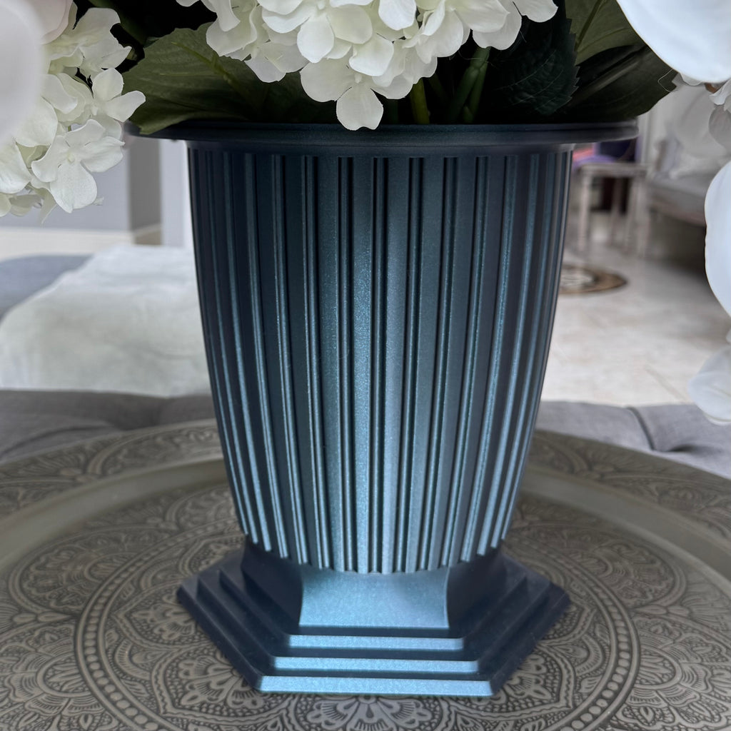 Grand Palais fluted pedestal vessel in Onyx Shimmer with decorative rim for D&W Delightful Wares Platinum permanent floral arrangements, approximately 12 inches high and 12 inches in diameter.