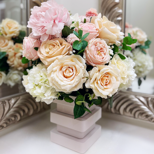 Atelier floral arrangement in the Bone White finish, Duchess size, Rosé Champagne palette, featuring lifelike blush peonies, garden roses, hydrangeas, and eucalyptus.