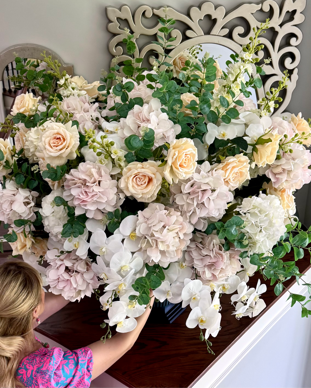 Grand Palais floral arrangement in the Onyx Shimmer finish, Platinum size, Rosé Champagne palette, featuring lifelike blush hydrangeas, cream roses, cascading white orchids, white peonies, flowering stems, and eucalyptus.