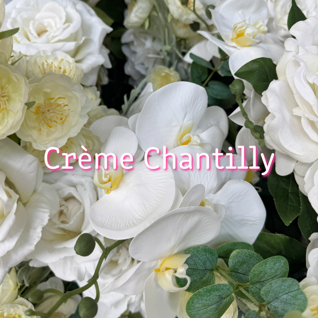 Crème Chantilly floral palette for the Grand Palais Premium and Platinum Collections, featuring lifelike white phalaenopsis orchids, ivory garden roses, spray roses, and eucalyptus.