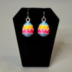 Painted Egg earrings displayed on jewelry bust