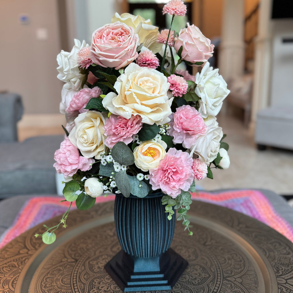 Column Vase floral arrangement in the Onyx Shimmer finish, Duchess size, Rosé Champagne palette, featuring lifelike blush pink and ivory roses, pink carnations, ranunculus, eucalyptus, and trailing greenery.