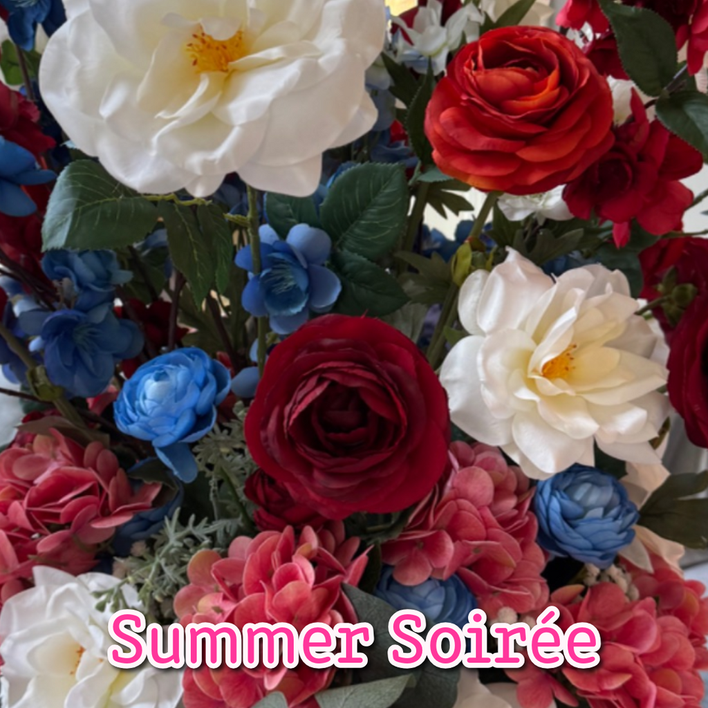 Summer Soirée permanent floral arrangement palette with ivory roses, red florals, blue accents, blush hydrangeas, and eucalyptus.