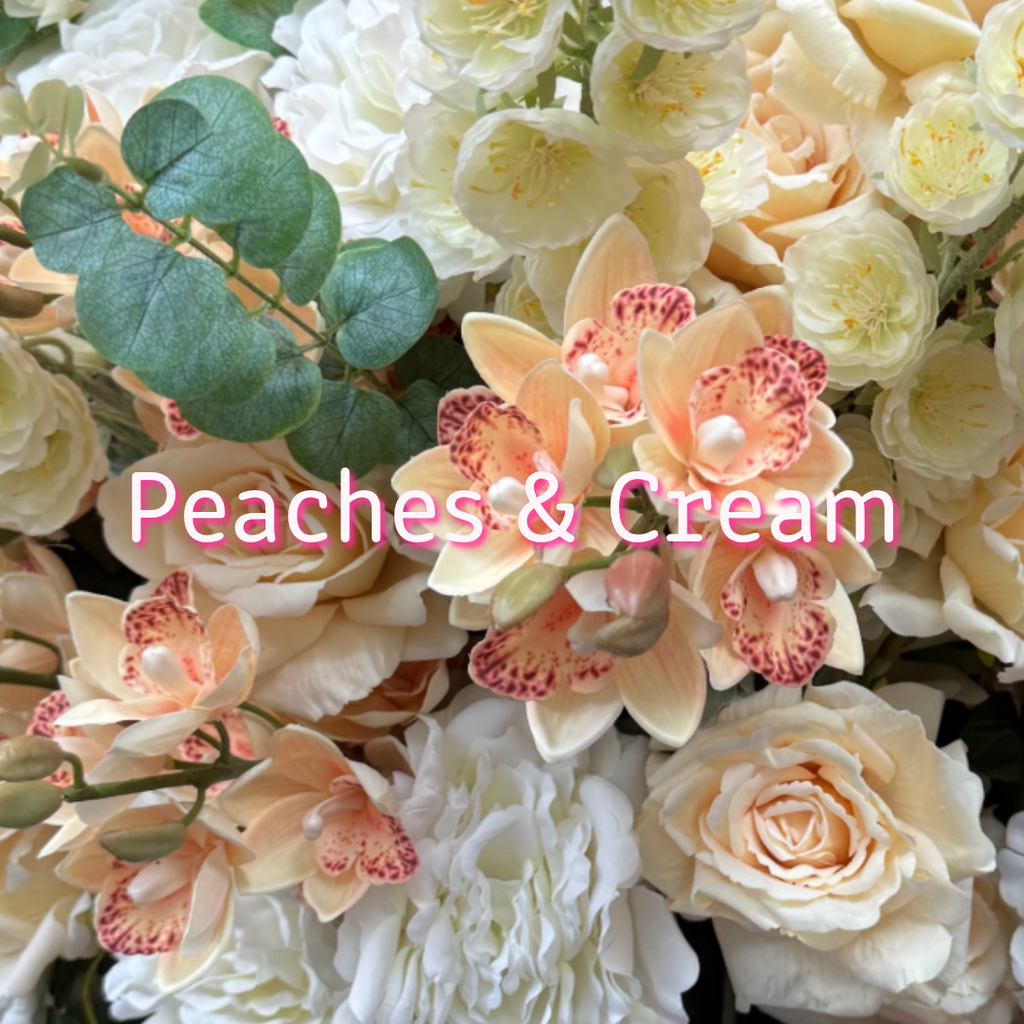 Peaches & Cream floral palette for the Grand Palais Premium and Platinum Collections, featuring lifelike peach orchids, ivory roses, white peonies, cream blossoms, and eucalyptus.