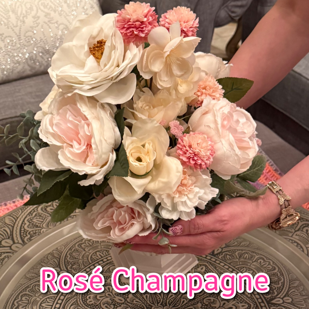Grand Palais Platinum Arrangement in Rosé Champagne featuring blush pink roses, champagne ivory florals, soft greenery, and premium blooms