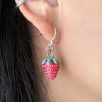 Close-up of strawberry dangle earrings featuring sterling silver hooks and vibrant strawberry charms.