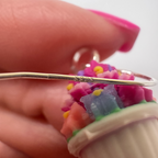 Close-up detail of Palais Bowl Earring showing sterling silver hook and miniature floral bowl charm