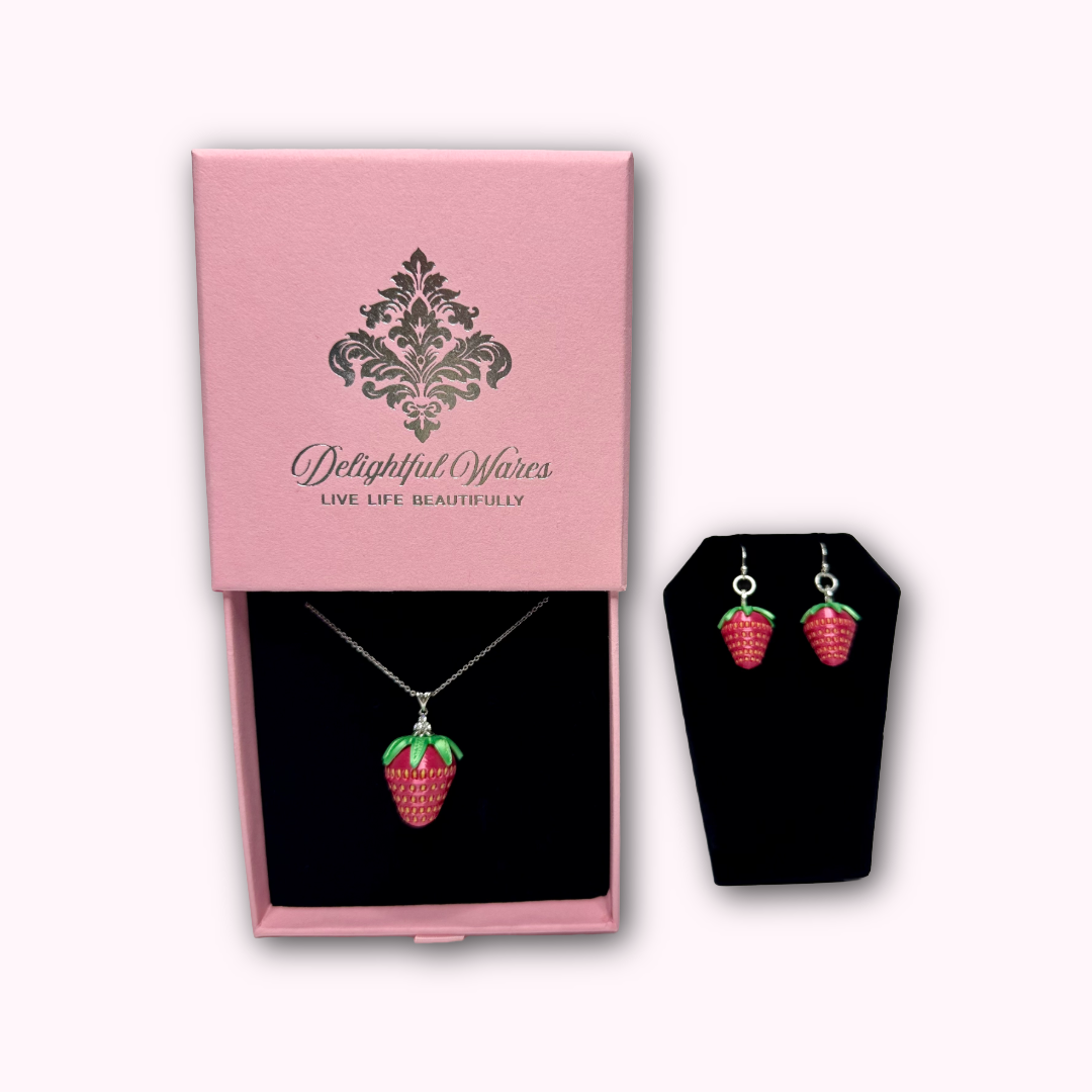 Strawberry dangle earrings with matching strawberry pendant necklace shown for styling inspiration. Necklace sold separately.
