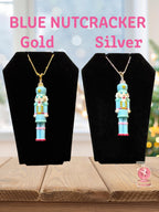 Blue Nutcracker necklace color options in gold and sterling silver finishes