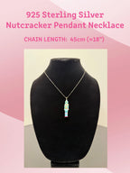 Green Nutcracker necklace displayed on jewelry stand