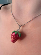 Strawberry pendant necklace on sterling silver chain worn by model