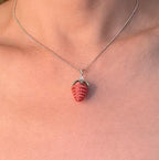 Strawberry pendant necklace worn by model