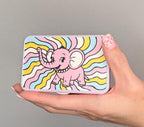 Pink Elephant magnetic pill box shown in hand for size reference