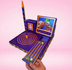 Frog Darn It! Luxury Yarn Spinner Organizer featuring a frog design with rotating yarn spinner, phone and tablet stand, knitting needle and crochet hook storage, scissor holder, and sliding storage compartment.