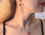 Strawberry pendant necklace worn by model side profile
