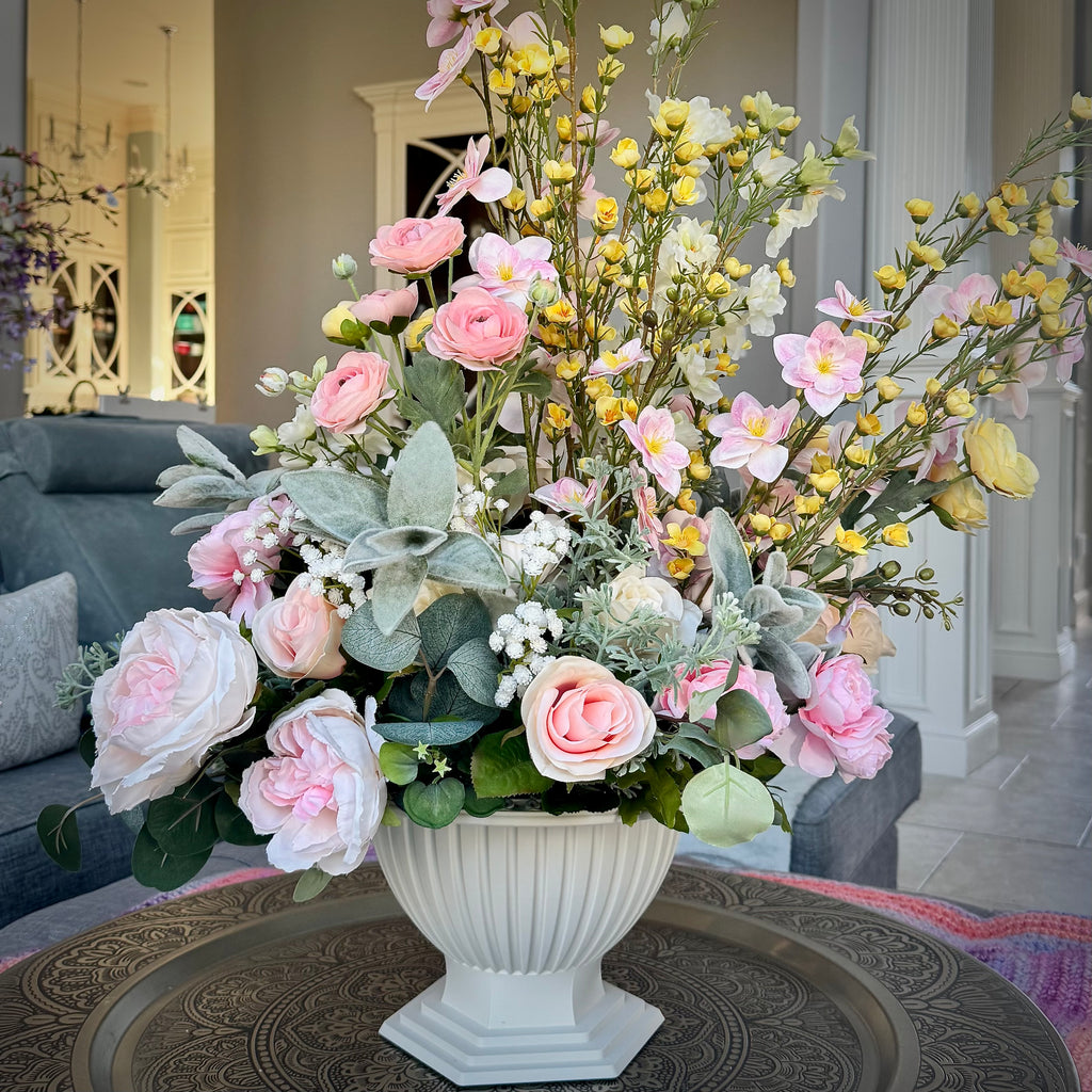 Palais Bowl floral arrangement in the Bone White finish, Queen size, Pink Lemonade palette, featuring lifelike blush pink roses, cherry blossoms, yellow blossoms, lamb's ear, baby's breath, and eucalyptus.