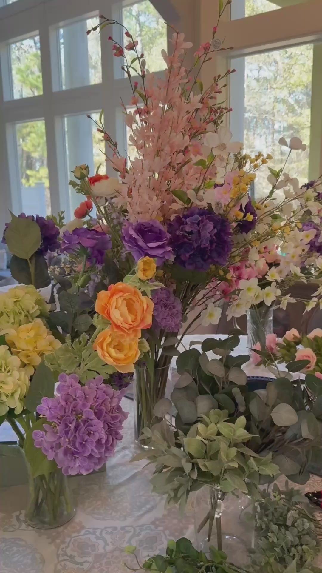 Artist assembling Palais Bowl permanent floral arrangements