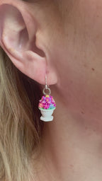 Floral bowl earrings with sterling silver hooks worn on ear