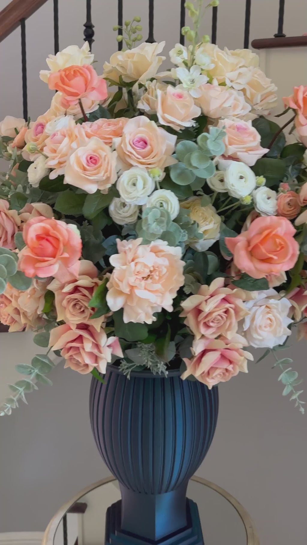 The Remembrance Column Vase permanent floral memorial arrangement demonstrating how the secure memorial chamber is concealed inside the sculptural vessel.